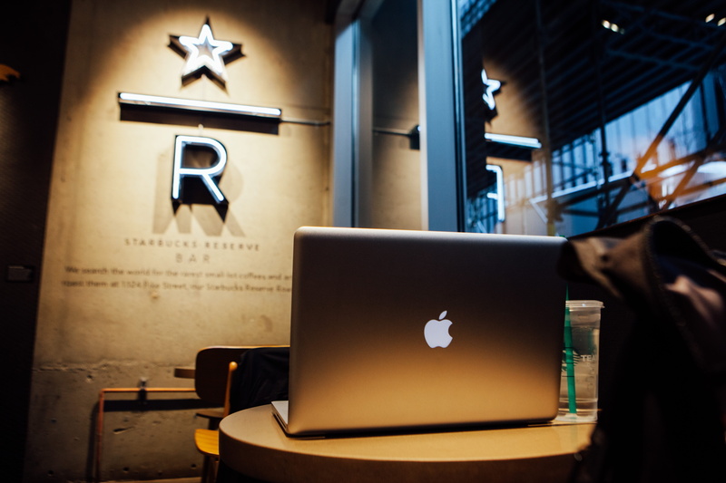 silver, human body part, wood - material, focus on foreground, sign, round, laptop, business, people, flying, table, computer, communication, website, work