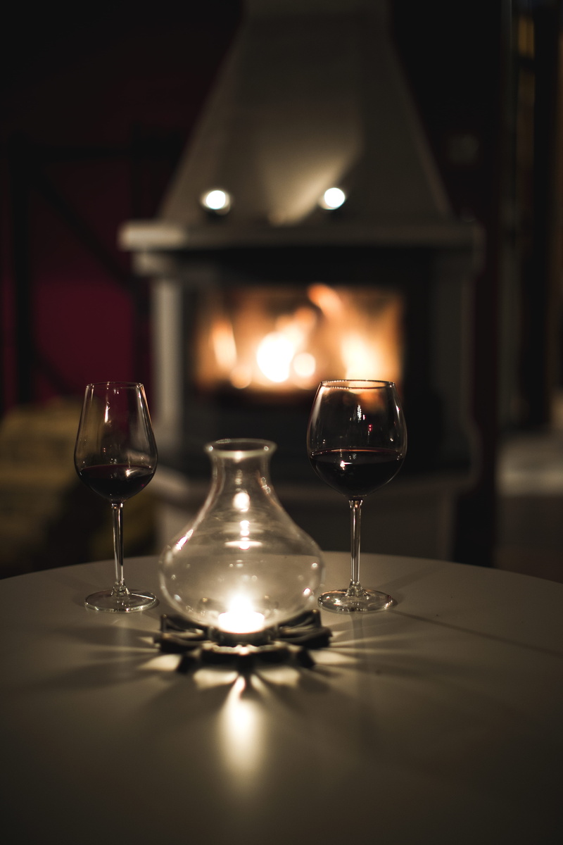 illuminated, food and drink, burning, still life, red wine, bottle, clear, two, no people, lighting equipment, cosy, refreshment, indoors, table, candle