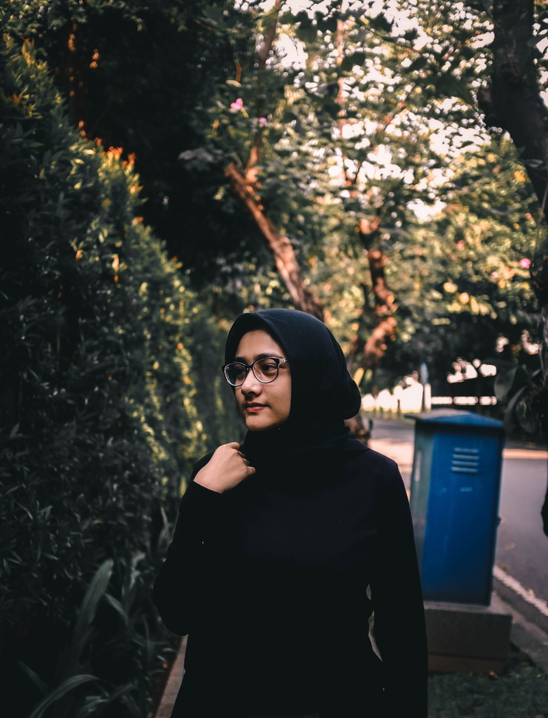 young adult, plant, waist up, outdoors, contemplation, sunglasses, abaya, fashion, casual clothing, young women, eyeglasses, glasses, standing, tree, nature