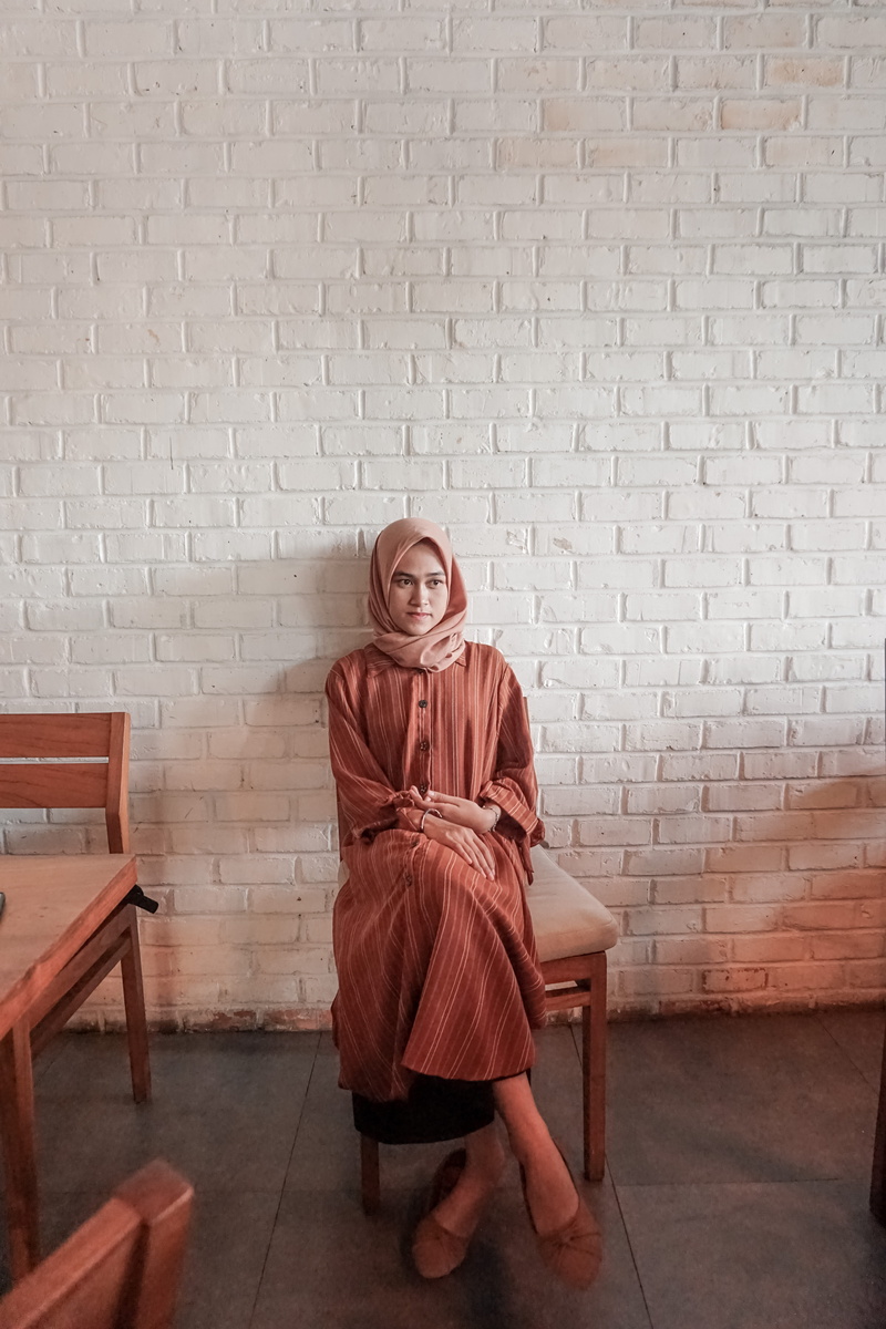 floor, gown, photo, chair, plywood, flooring, front view, hardwood, real people, clothing, leisure activity, evening dress, couch, apparel, looking at camera