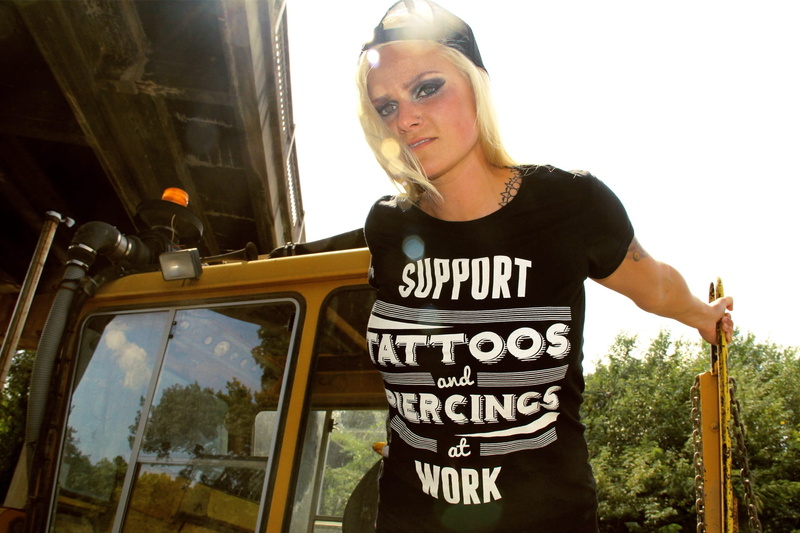 job, looking at camera, text, caucasian, adults only, piercing, tattooed, tractor, modeling, fashion, 1080P, hat, Female, Train, rock, adult, solar flare