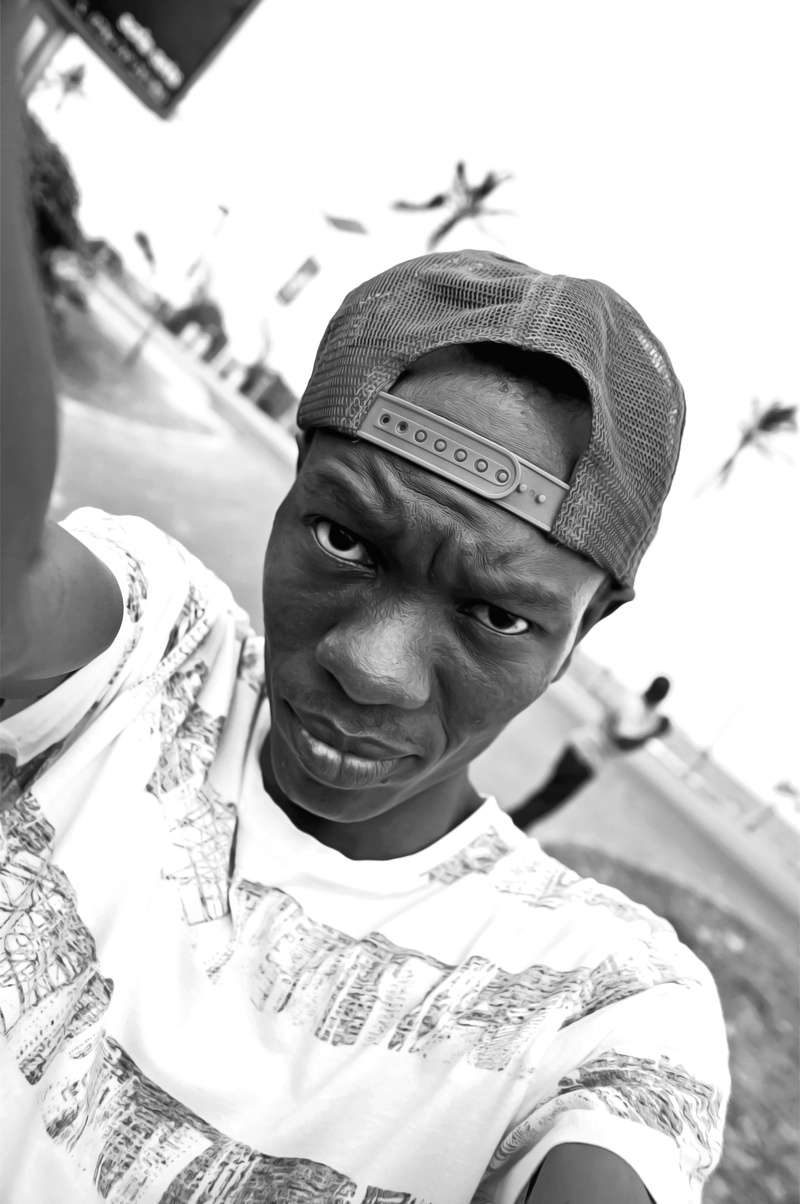 a black man, selfie, young black adult, 4K, adult, clothing, real people, smiling, headshot, males, focus on foreground, front view, me, cap, looking at camera