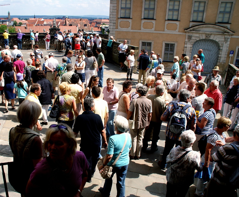 city life, group, architecture, daytime, near, mixed age range, adult, real people, meeting, south, people, concrete, building, standing, together, crowded
