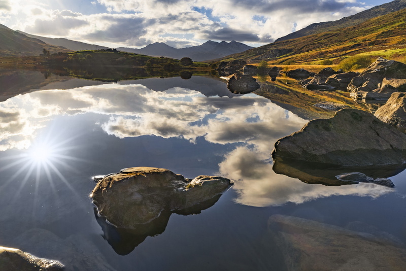 outdoors, tranquil scene, no people, nature, mountain, lake, rock, beauty in nature, 4K, water, sunbeam, day, sun, reflection, cloud - sky, relection