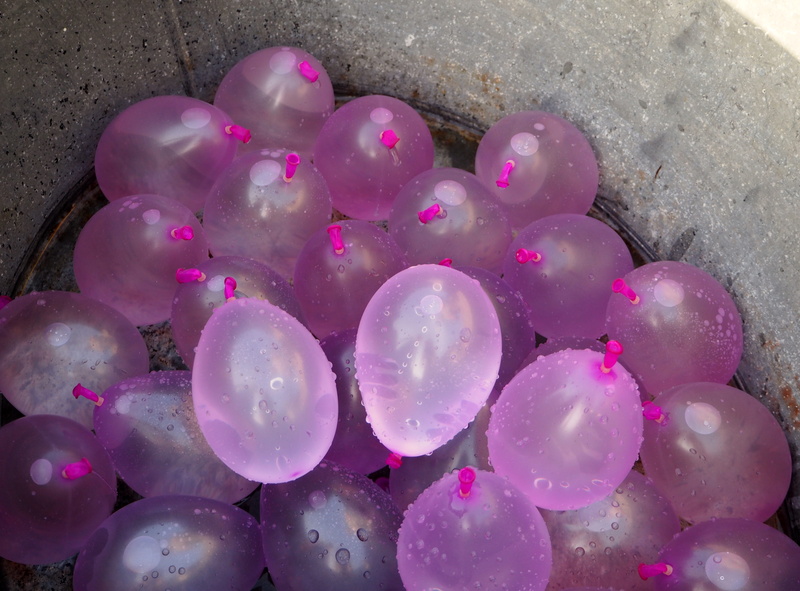 water balloons, wet, animals in the wild, cooling, summer, burst, outdoors, pink color, beauty in nature, water filled, large group of objects, water fun