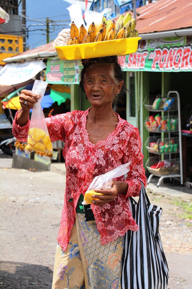 front view, senior adult, street sales, portrait, multi colored, bali, real people, women, 5K, standing, adult, lifestyles, outdoors, hairstyle, emotion