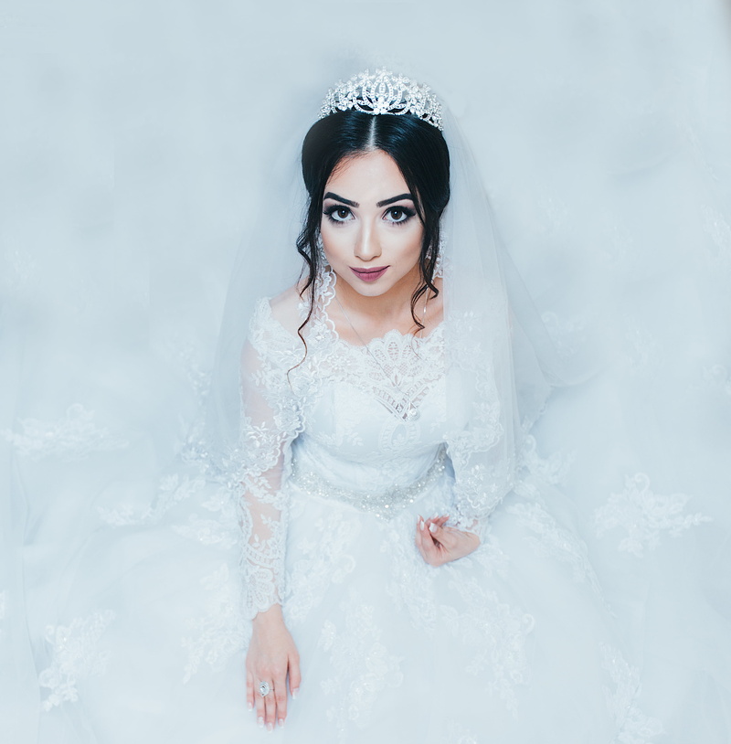 looking at camera, ring, makeup, woman, white color, floral, bride, only women, beautiful, portrait, luxury, beautiful woman, one woman only, cold temperature