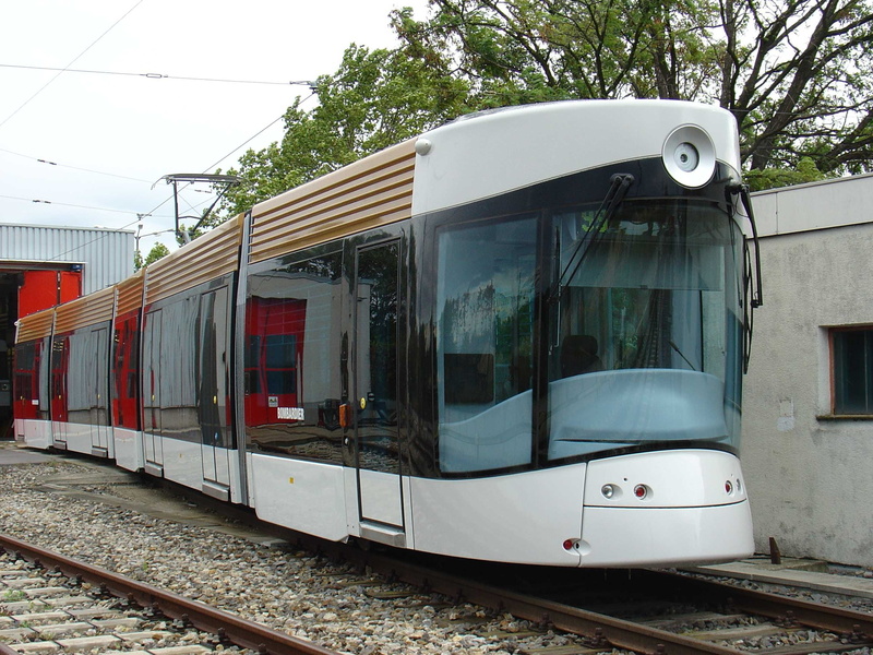 station, outdoors, tourist town, mode of transportation, displacement, City, tram, track, journey, window, day, power supply, rail transportation, no people