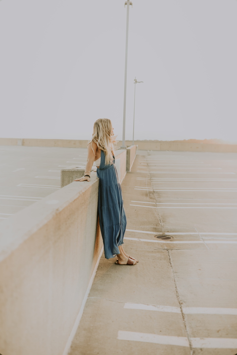 architecture, hair, downtown, hairstyle, summer, wood, adventure, leisure activity, leaning, sunset, 5K, full length, one person, rear view, sleeve, apparel