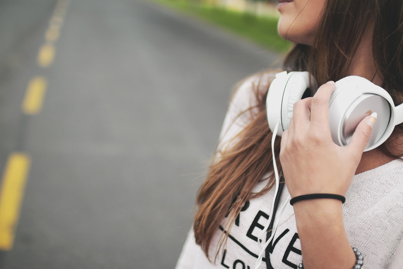 hairstyle, wearing, young adult, people, 2K, one young woman only, corded, holding, ear, day, white, road, girl, girls, music, shirt, woman, beautiful woman