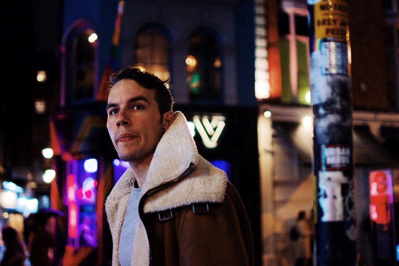 young men, man, city, person, night life, overcoat, real people, standing, fashion, scarf, nightlife, men’s fashion, young adult, drink, illuminated, coat