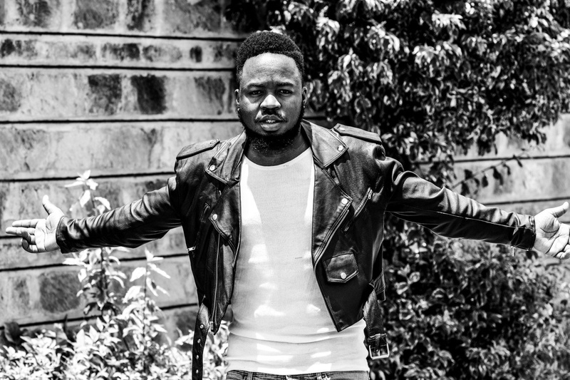 outfit, one person, plants, wearing, real people, smiling, black leather jacket, day, focus on foreground, standing, close-up, young adult, males, men