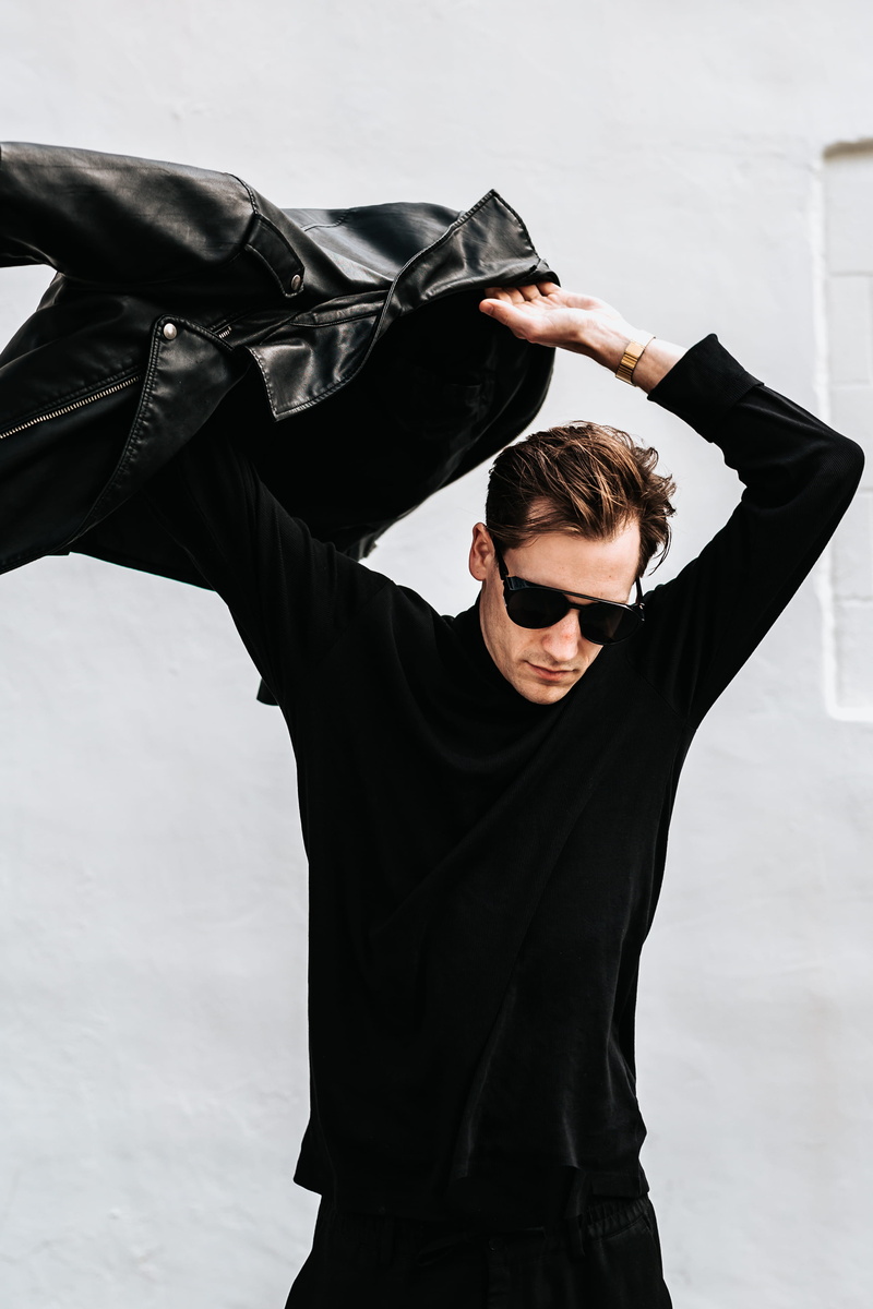 real people, sunglasses, 2K, standing, man, young adult, three quarter length, men, leather, portrait, white, fashion, clothing, front view, casual clothing