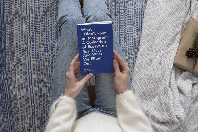 human limb, holding, one person, casual clothing, message, midsection, essay, connection, hand, reading, human hand, body part, title, indoors, blue, sitting