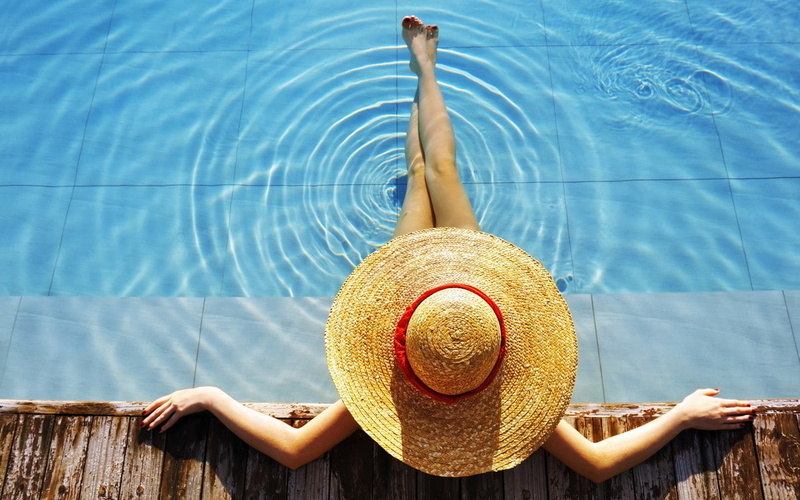 one person, outdoors, lifestyles, young adult, water, women, hat, legs, pool, day, sun hat, nature, human arm, summer, model, relaxation, directly above
