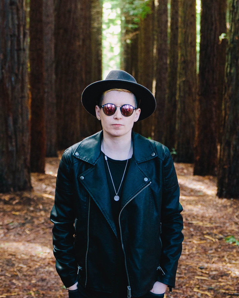 front view, clothing, model, reflective sunglass, uniform, zip, leisure activity, 1080P, person, biker, full, man, focus on foreground, day, plant, trees