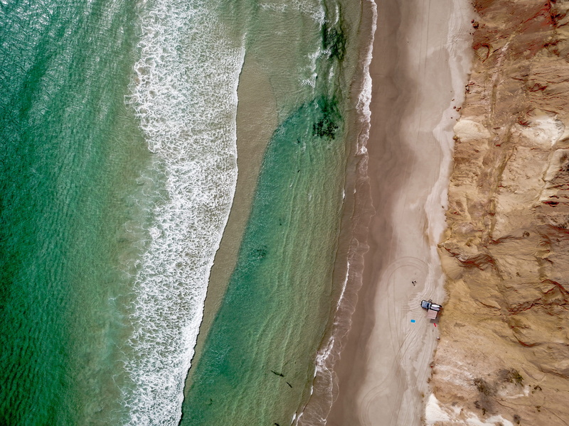 scenics - nature, environment, drone footage, sea foam, rock - object, people, coast, coastline, shore, seashore, h2o, daytime, colors, sight, oceanside