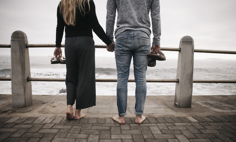 from behind, couple, railing, people, woman, 5K, heterosexual couple, positive emotion, bare feet, travel, outdoors, lifestyles, hands, jeans, women, shoreline