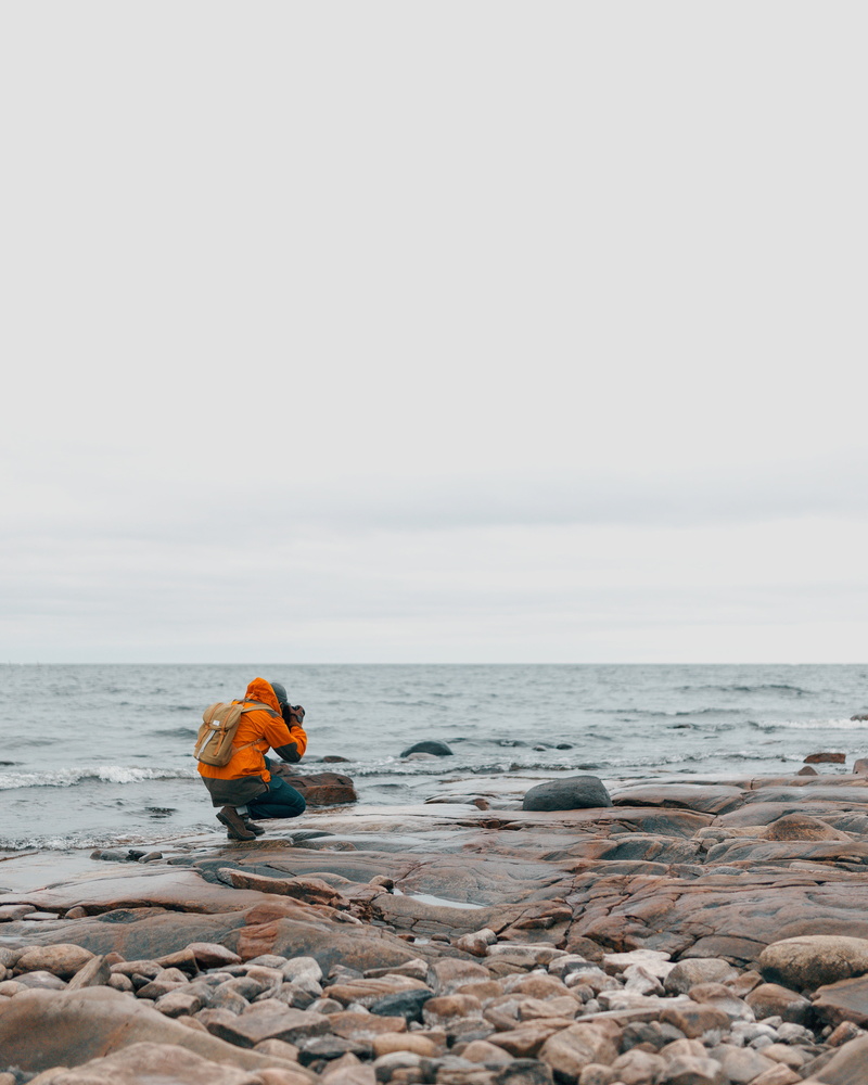 water, full length, beside, land, people, man, formation, alone, body, rock - object, taking, rock, day, one person, sea, coast, adults only, horizon, photo