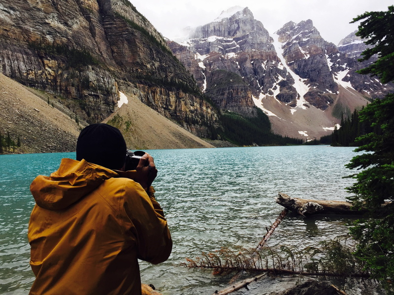 exploration, orange jacket, lifestyles, men, relaxation, backpack, cold, cliff, taking photo, travel, canada, tranquil Scene, scenics, adult, behind, nature