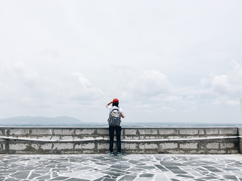 sky, solitude, adult, landscape, traveler, people, lake, water, from behind, leisure activity, weather, pier, wall, grey, beauty in nature, man, backpacker