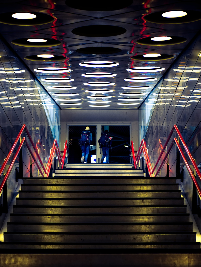 illuminated, low angle view, modern design, people, public transportation, women, lighting, steps and staircases, reflection, light, group of people, pedestrian