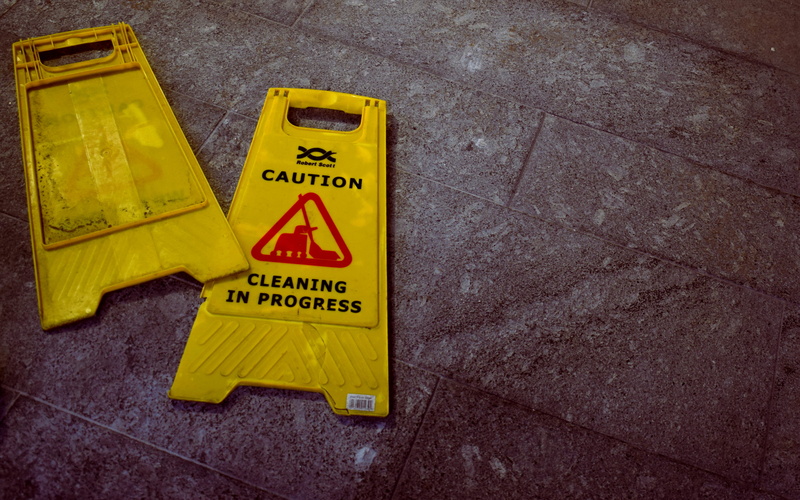 western script, high angle view, close-up, work, sign, day, no people, janitor, safety, cleaner, outdoors, road, ground, dark, signages, dirty, signage
