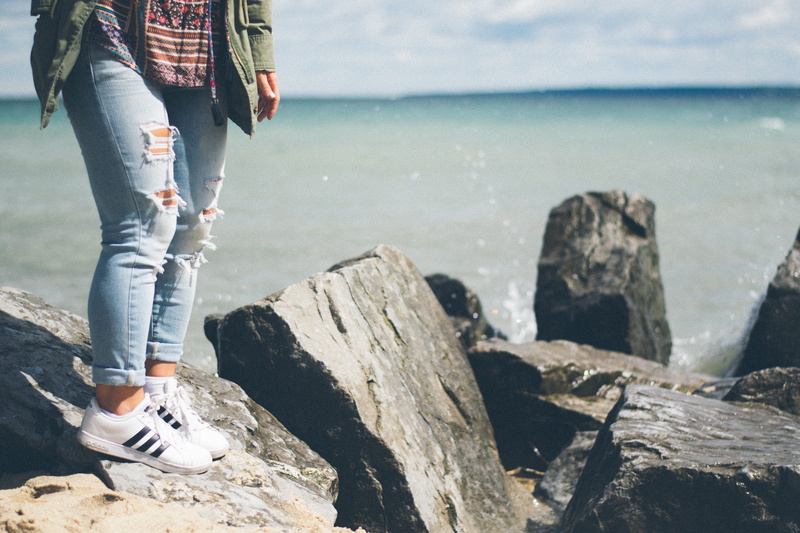 shoe, person, casual clothing, cool, beach, woman, cuffed, solid, standing, fashion, land, body, ocean, day, focus on foreground, ankle, lake, gray, leisure activity