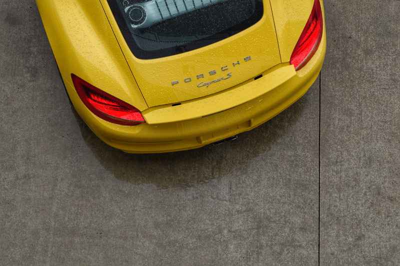 photography, tail light, wet car, transportation, luxury brand, 5K, porsche, wet, yellow, land vehicle, car, indoors, absence, two objects, wheel, angle