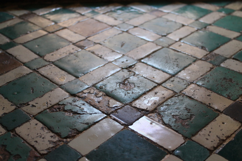 moorish, focus on foreground, outdoors, wet, shape, stone, no people, tile, pattern, rainy season, footpath, paving stone, tiled floor, rain, high angle view