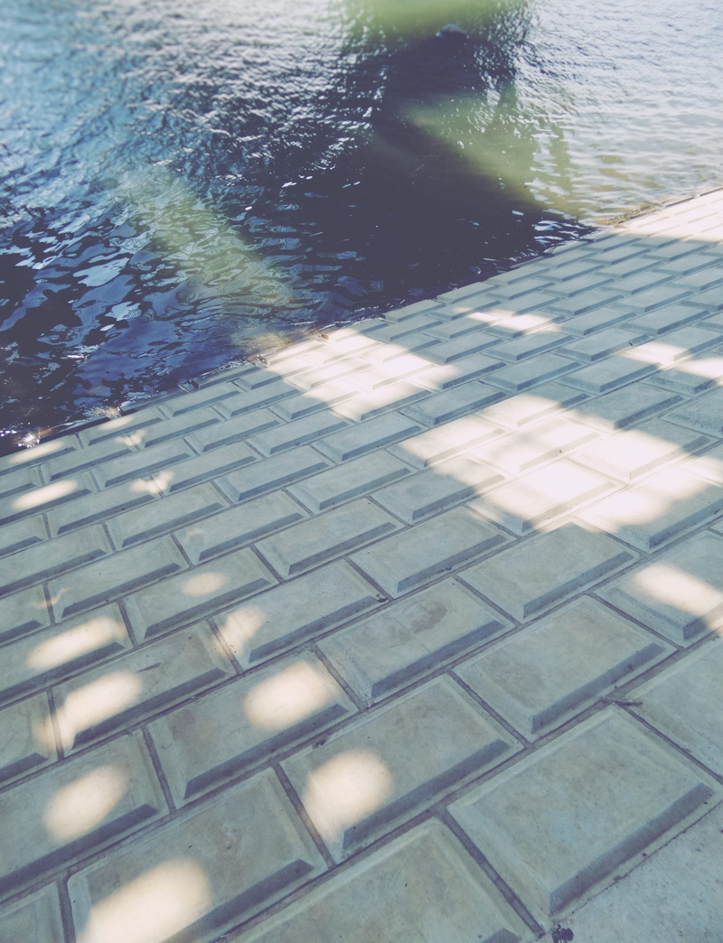 footpath, river, pattern, flooring, tiles, no people, swimming pool, shadows, plant, reflection, waterfront, geometry, squares, concrete, outdoors, rectangles