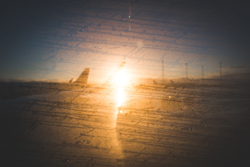 vignette, wings, sport, landing, rain, sky, tranquility, flooring, beauty in nature, no people, day, streak, hardwood floor, plane, sunlight, landed, window