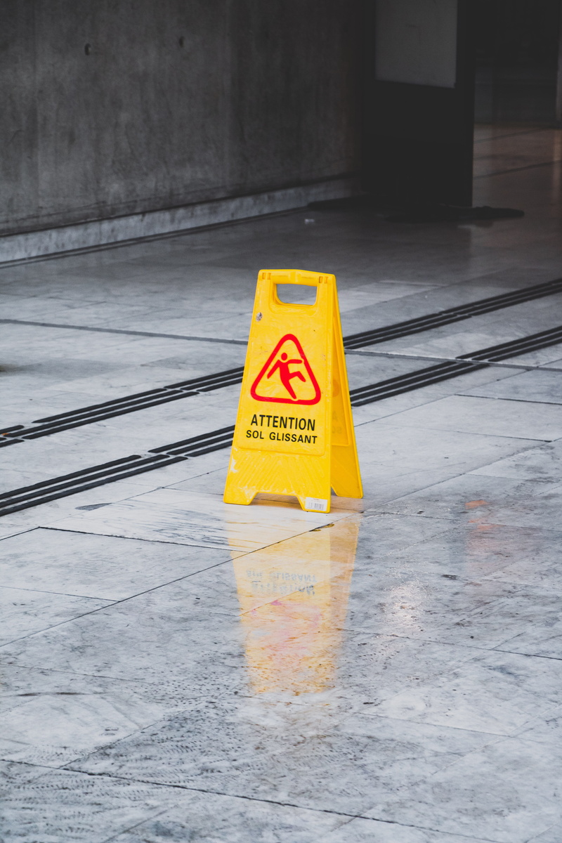 yellow, road warning sign, architecture, slippery, text, outdoors, security, protection, tiled floor, city, sign, wet, communication, risk, flooring, warning sign