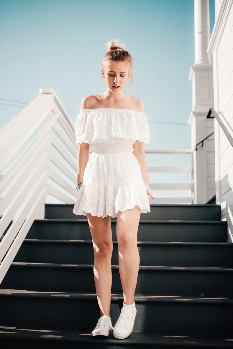hairstyle, looking at camera, sky, daytime, white color, portrait, one person, white, woman, stair, stairway, female, full length, women, clear, front view
