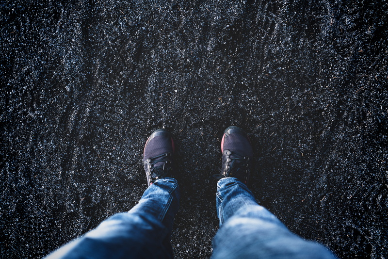real people, blue, lifestyles, walking, black sand, one person, 8K, still, directly above, human body part, body part, human leg, men, gravel, jeans, day