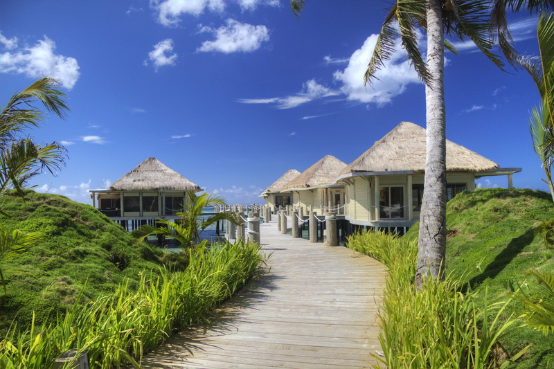 built structure, beach hut, nature, tropical climate, vacation, house, blue, no people, cloud - sky, palm tree, paradise, beauty in nature, outdoors, tree