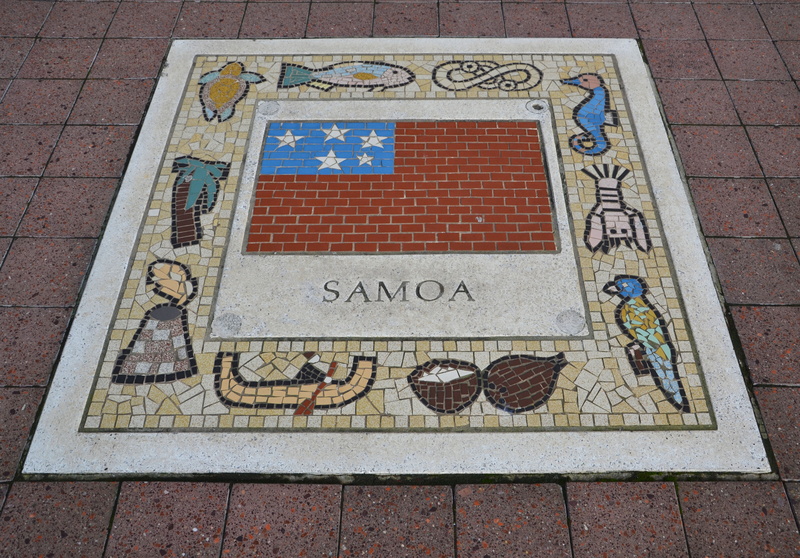 paving stone, togetherness, football, outdoors, close-up, high angle view, symbol, soccer, pattern, non-western script, rugby, sidewalk, samoa, team emblem