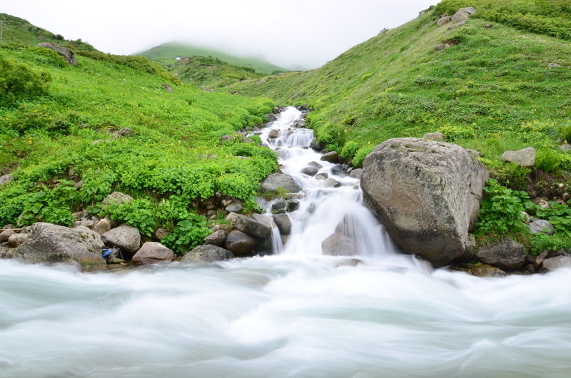 road, waterfall, scenics - nature, no people, beauty in nature, plateaus, solid, non-urban scene, great, flowing water, water, environment, rock, mountains