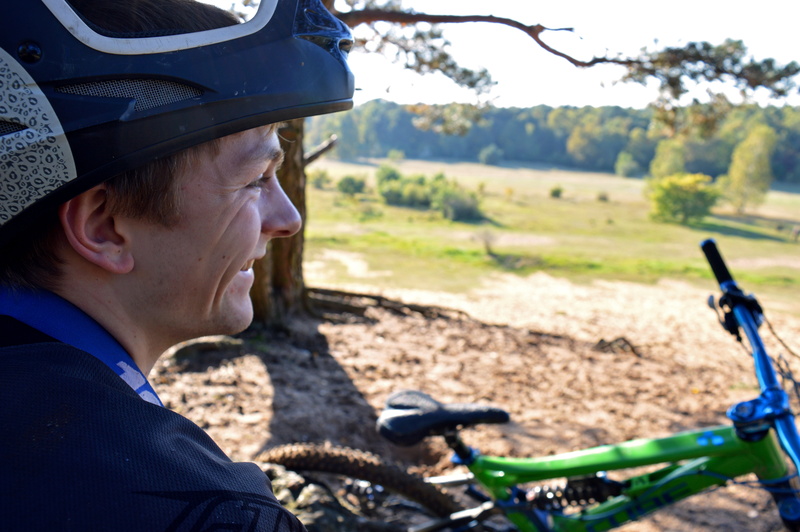 hobby, meadow, men, focus on foreground, riding, helm, sun, emotion, sport, sunlight, green, creative skills, eyes, bicycle, cheerful, background, nature