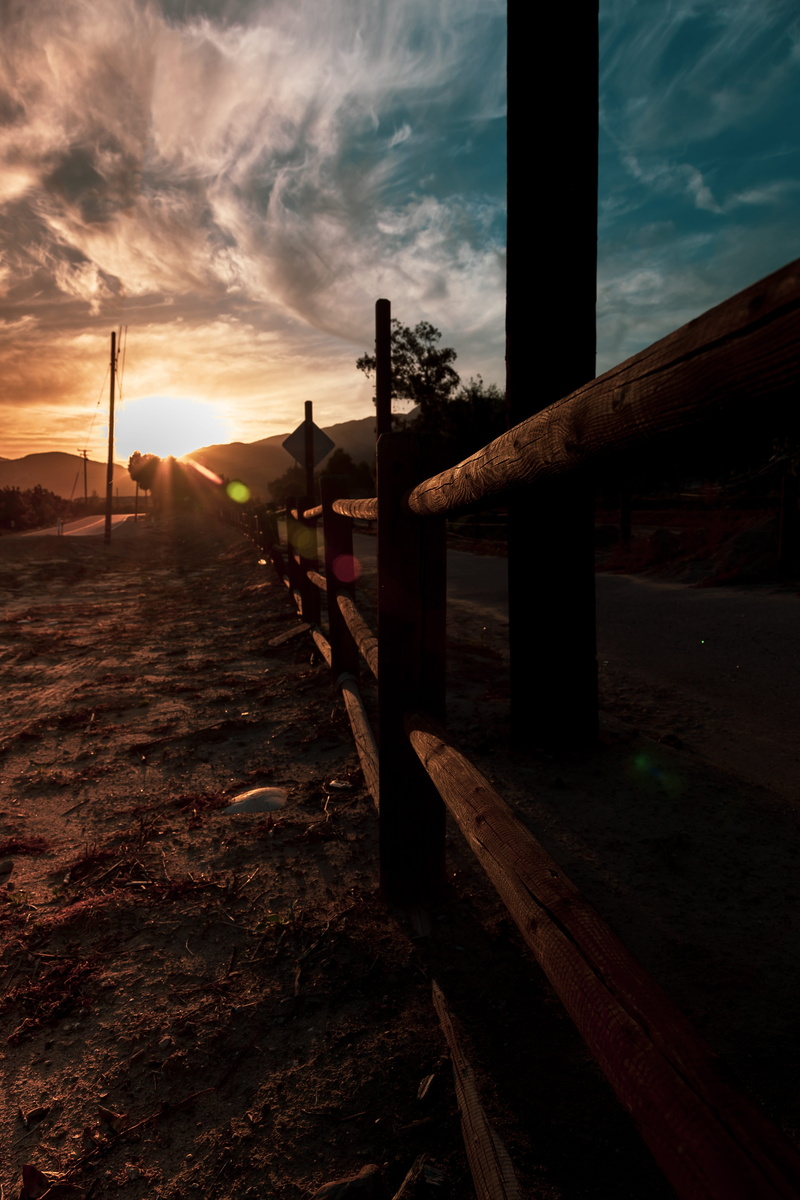 fance, sky, silhouette, piru, direction, building exterior, roadwalk, orange color, beauty in nature, cloud - sky, sunbeam, 5K, united states, land, no people