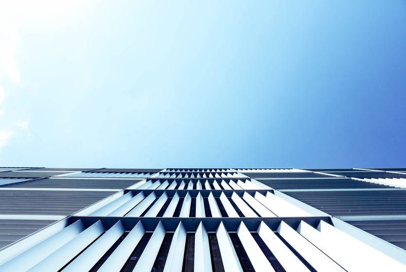 building, clouds, nature, sunlight, blue sky, architecture, directly below, shadow, copy space, tall - high, clean, looking up, urban, day, minimal, wood - material