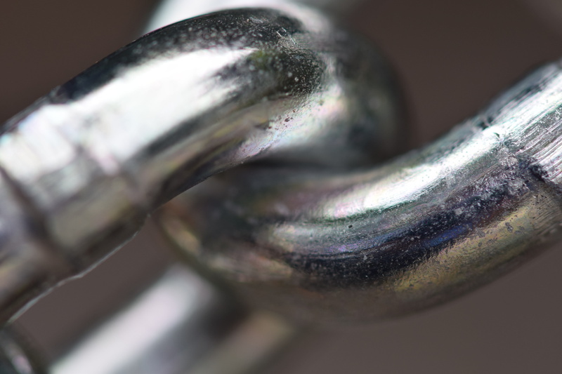 cohesion, studio shot, single object, focus on foreground, metal, food and drink, members, no people, chain link, connected, extreme close-up, food, chain