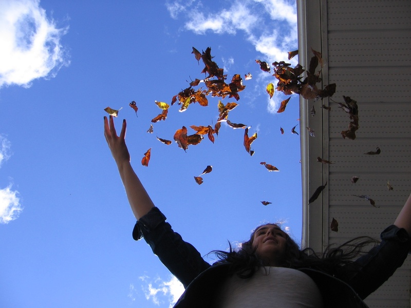 day, low angle view, 1080P, lifestyles, girl, tree, flying, throwing, leisure activity, plant part, leaves, throw, sky, mid-air, real people, leaf, women