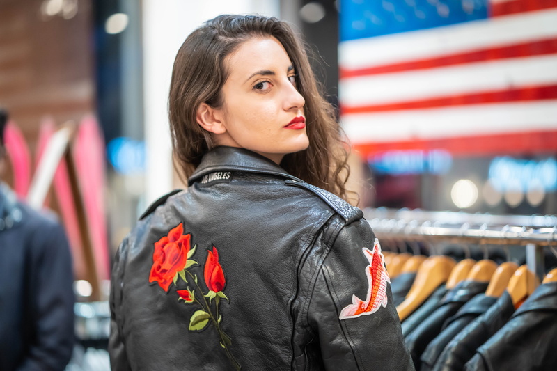 cute, architecture, clothing, beauty, wearing, young adult, facial expression, focus on foreground, flag, real people, leather, stylish, women, black, elegant