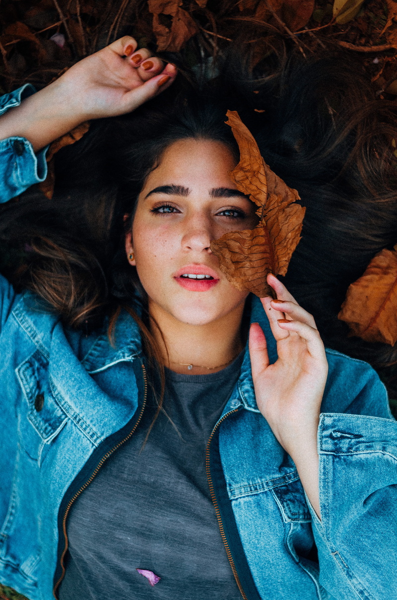 leaves, jacket, looking at camera, make-up, close-up, style, woman, real people, wearing, portrait, grey, casual clothing, headshot, one person, eyes, indoors
