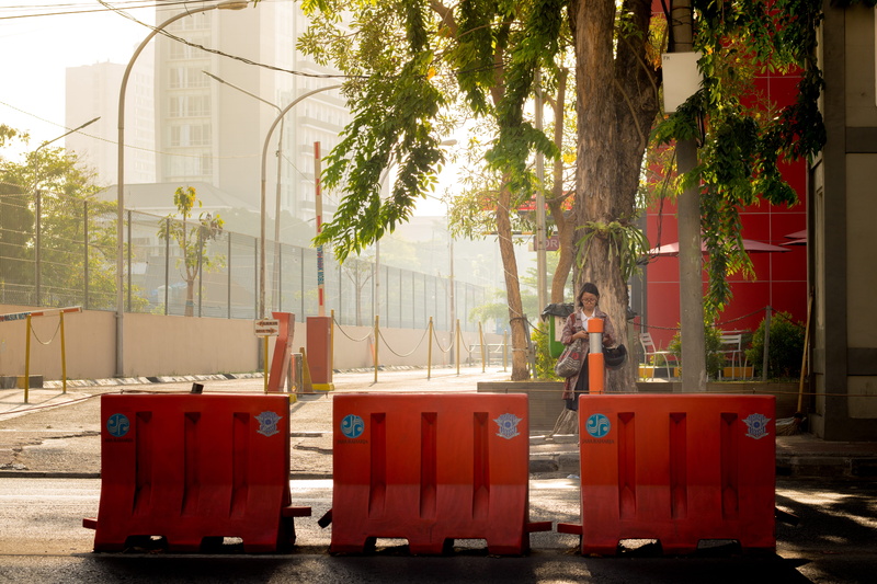 built structure, red, one person, street, garbage bin, architecture, building, lifestyles, outdoors, day, jalan basuki rahmat, indonesia, 5K, tree, plant