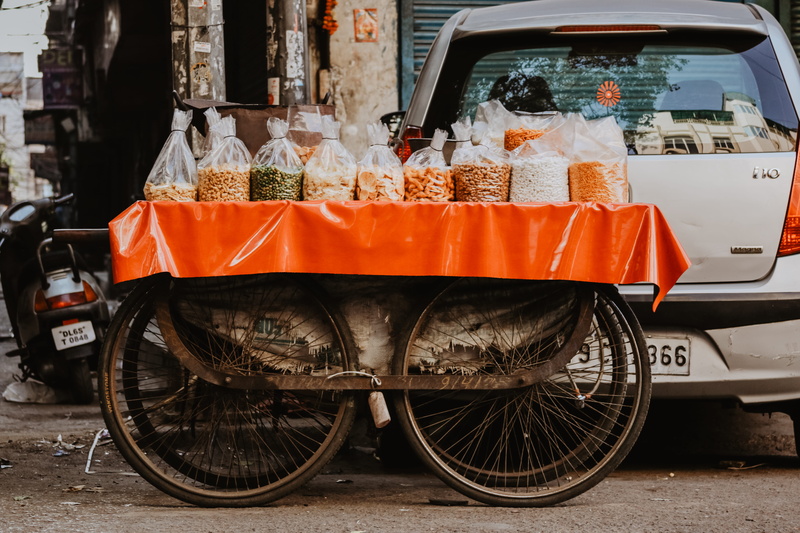 bicycle, brown, spice, built structure, bike, nuts, day, transportation, land vehicle, mode of transportation, for sale, motor vehicle, bag, seller, market
