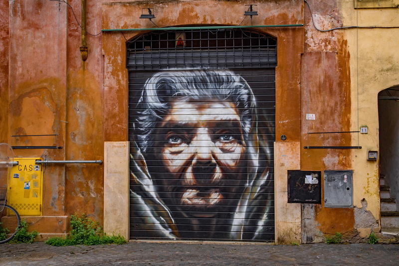 brick, outdoors, looking at camera, portrait, graffiti, architecture, europe, wall, urban, grunge, headshot, building, real people, abandoned, italy, leisure activity