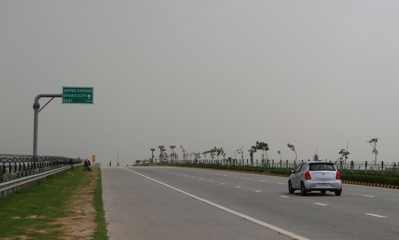 land vehicle, road trip, Delhi, highway, car, motor vehicle, taj expressway, no people, outdoors, sign, yamuna, marking, Yamuna Expressway, road, symbol