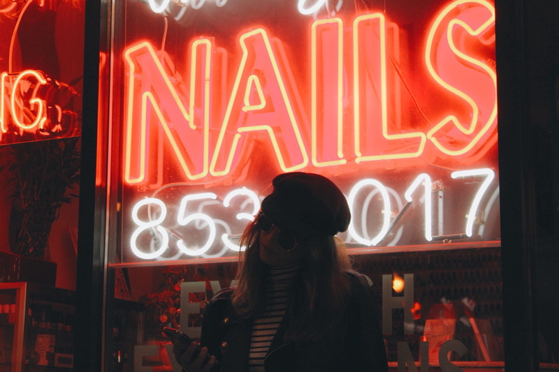 glass, one person, lighting equipment, wall, 2K, illuminated, urban, night, sign, consumerism, architecture, woman, western script, led, neon, communication